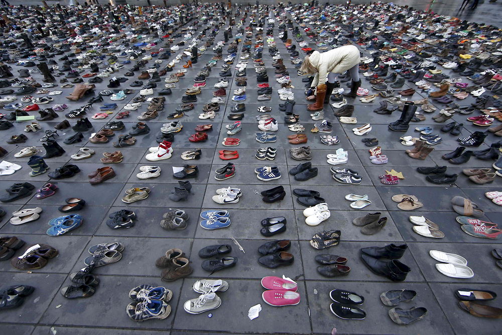 Pairs of shoes are symbolically placed on the Place de la Republique, after the cancellation of a planned climate march following shootings in the French capital, ahead of the World Climate Change Conference 2015 (COP21), in Paris, France, November 29, 2015. REUTERS/Eric Gaillard TPX IMAGES OF THE DAY