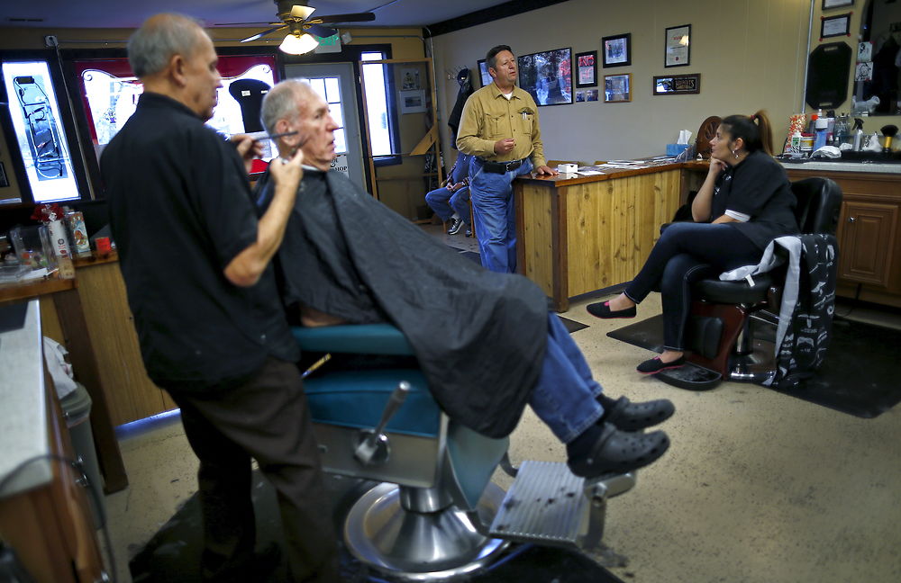 U.S. Republican presidential candidate Michael Petyo campaigns in a barber shop in Hobart, Indiana, November 17, 2015. Reuters Photographer Jim Young: "Hillary and Donald are running. So are more than 1, 500 others, among them Michael Petyo of Hobart, Indiana. He's not a household name, nor does he have millions of dollars in backing. Petyo is a building contractor, a father and a U.S. Navy veteran. Back in May, Petyo handed me his card. He was outside an event in Des Moines, Iowa, attended by leading potential Republican candidates. Petyo said the party wouldn't let him inside. We only spoke for a minute. Months later, I read of a few hundred people having already signed up to run for president: businesspeople, teachers, bartenders. Petyo lives about 75 miles from me so I arranged to meet. We spoke for a couple of hours at his dinner table with his wife. This is my fourth presidential election campaign. I have logged countless miles and been to hundreds of events - but always with candidates with massive financial backing and support from countless volunteers. Petyo has business cards, his van, his beliefs. He speaks about the working class, faith, the military. In his spare time he bakes to raise money for the church. Religion is important to him and he speaks about it passionately. Over the months we meet up while he campaigns and goes about his life. Petyo drives to a Republican debate in Milwaukee in November; the door is shut there too. He still works the lines of attendees outside. In Chicago people brush by on a cold, windy day as he tries to introduce himself. Some stop to ask him about his policies. He is not a full-time politician, just a regular guy facing what many would call insurmountable obstacles. It's quite the understatement to say the odds are stacked against him. But that shouldn't stop him or anyone from trying." REUTERS/Jim Young SEARCH "PETYO" FOR ALL IMAGES