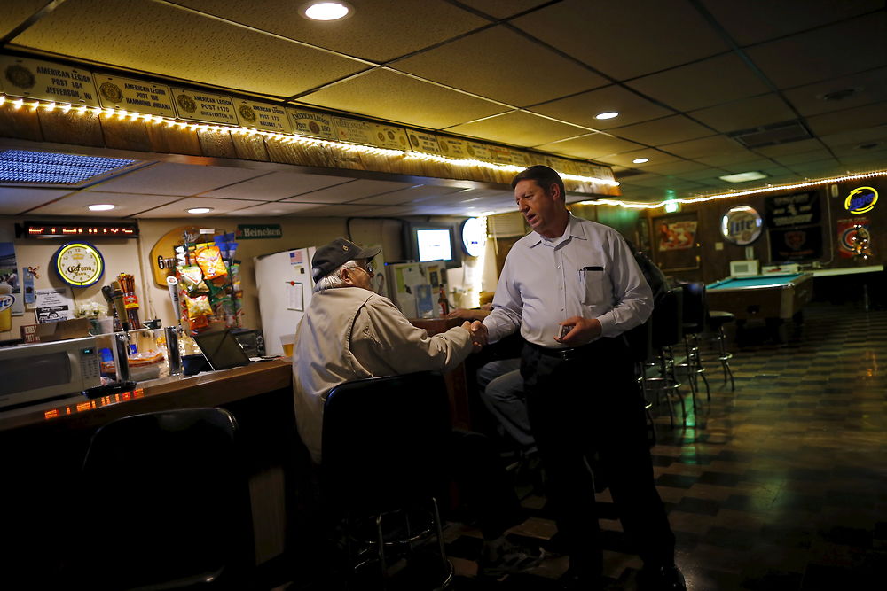 U.S. Republican presidential candidate Michael Petyo speaks to a patron while campaigning at the American Legion in Highland, Indiana, United States, December 15, 2015. Reuters Photographer Jim Young: "Hillary and Donald are running. So are more than 1, 500 others, among them Michael Petyo of Hobart, Indiana. He's not a household name, nor does he have millions of dollars in backing. Petyo is a building contractor, a father and a U.S. Navy veteran. Back in May, Petyo handed me his card. He was outside an event in Des Moines, Iowa, attended by leading potential Republican candidates. Petyo said the party wouldn't let him inside. We only spoke for a minute. Months later, I read of a few hundred people having already signed up to run for president: businesspeople, teachers, bartenders. Petyo lives about 75 miles from me so I arranged to meet. We spoke for a couple of hours at his dinner table with his wife. This is my fourth presidential election campaign. I have logged countless miles and been to hundreds of events - but always with candidates with massive financial backing and support from countless volunteers. Petyo has business cards, his van, his beliefs. He speaks about the working class, faith, the military. In his spare time he bakes to raise money for the church. Religion is important to him and he speaks about it passionately. Over the months we meet up while he campaigns and goes about his life. Petyo drives to a Republican debate in Milwaukee in November; the door is shut there too. He still works the lines of attendees outside. In Chicago people brush by on a cold, windy day as he tries to introduce himself. Some stop to ask him about his policies. He is not a full-time politician, just a regular guy facing what many would call insurmountable obstacles. It's quite the understatement to say the odds are stacked against him. But that shouldn't stop him or anyone from trying." REUTERS/Jim Young SEARCH "PETYO" FOR ALL IMAGES