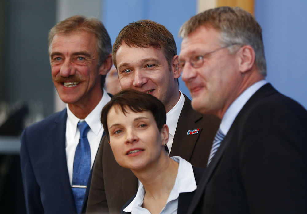Frauke Petry (C), chairwoman of the anti-immigration party Alternative for Germany (AfD) and Uwe Junge, AfD candidate in Rhineland-Palatinate, Andre Poggenburg, candidate in Saxony-Anhalt and Joerg Meuthen, candidate in Baden-Wuerttemberg, (L-R) pose as they arrive for a news conference in Berlin, Germany, March 14, 2016. REUTERS/Pawel Kopczynski TPX IMAGES OF THE DAY
