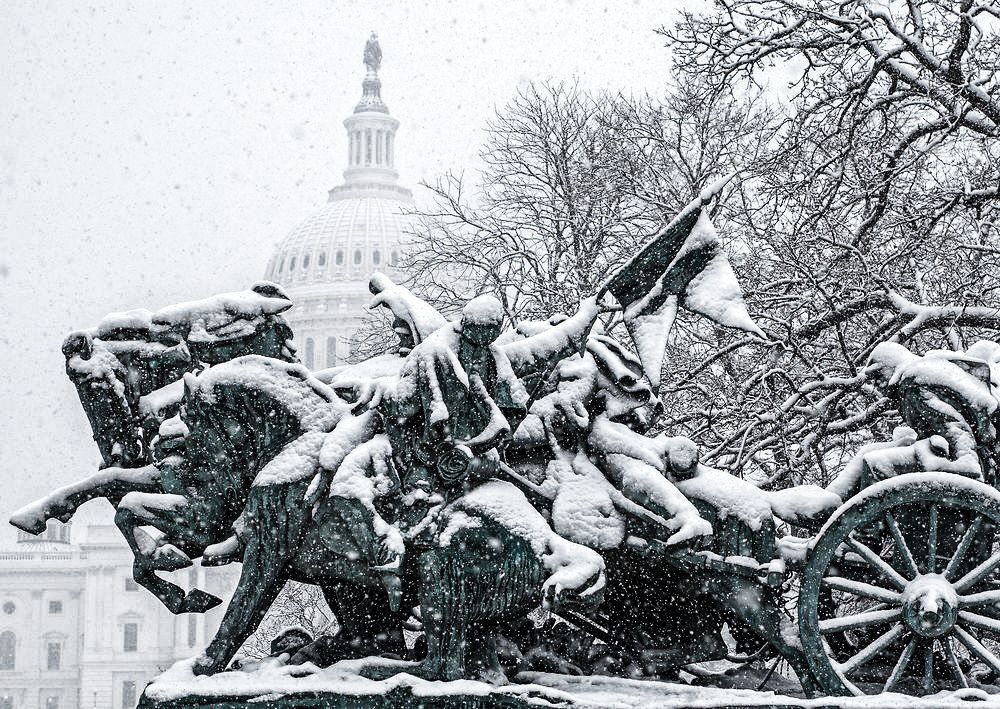 The artillary section of the Ulysses S. Grant Memorial is seen on the grounds of the US Capitol on February 25, 2014 after morning snow showers in the Washington, DC Area. TOPSHOTS/AFP PHOTO/Paul J. Richards